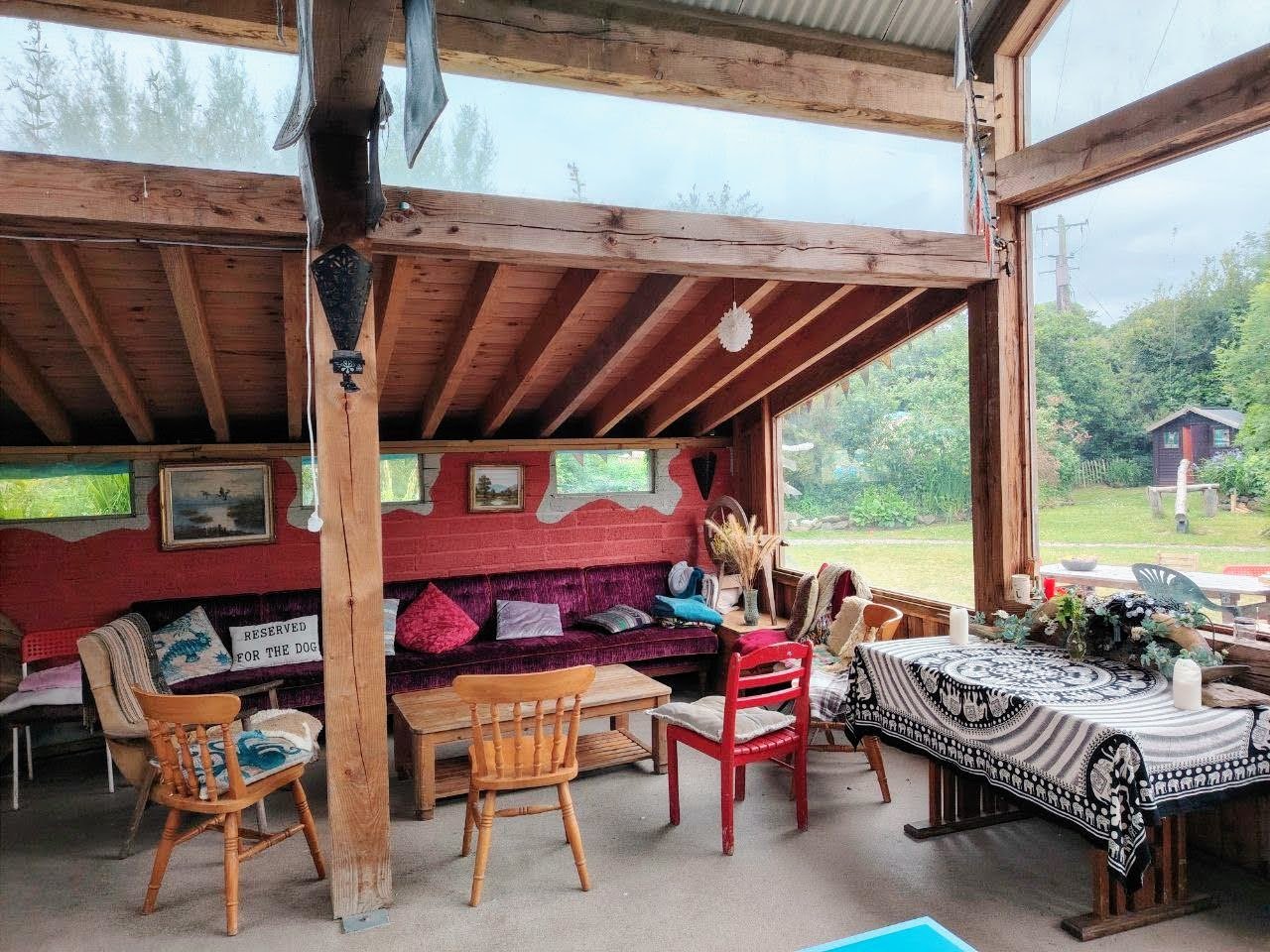 Cozy interior of a yurt at Inch Hideaway with wood-fired stove