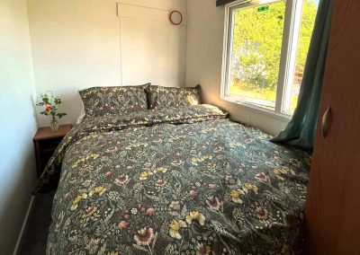 Interior of the Cara Van Haven with cozy furnishings and timber features