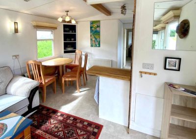 Interior of the Cara Van Haven with cozy furnishings and timber features