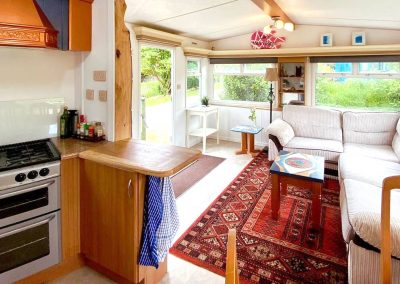 Interior of the Cara Van Haven with cozy furnishings and timber features