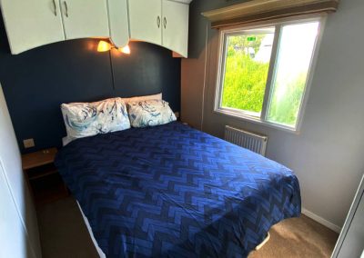 Interior of the Cara Van Haven with cozy furnishings and timber features