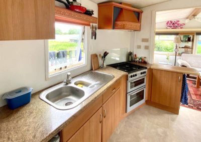 Sunny deck area of the Cara Van Haven overlooking the countryside