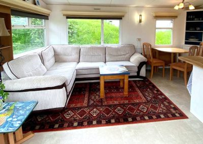 Interior of the Cara Van Haven with cozy furnishings and timber features